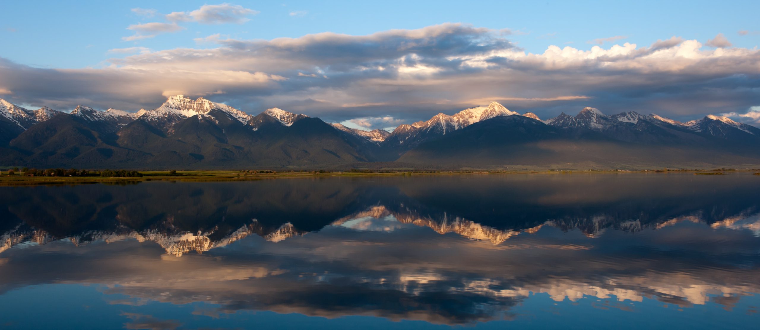 A beautiful mirror of the Mission mountain range in northern Montana.  The placid lake at Ninepipes is perfectly calm and stunning.